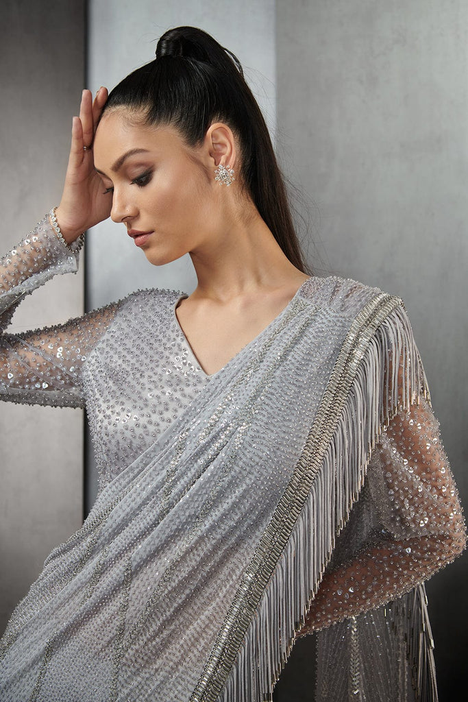 DRAPED SAREE WITH METALLIC FRINGES, PAIRED WITH A ONE-SHOULDER